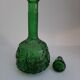 Empoli green glass bottle, zodiac signs