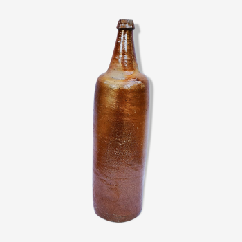 Old bottle in glazed terracotta.