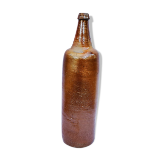 Old bottle in glazed terracotta.