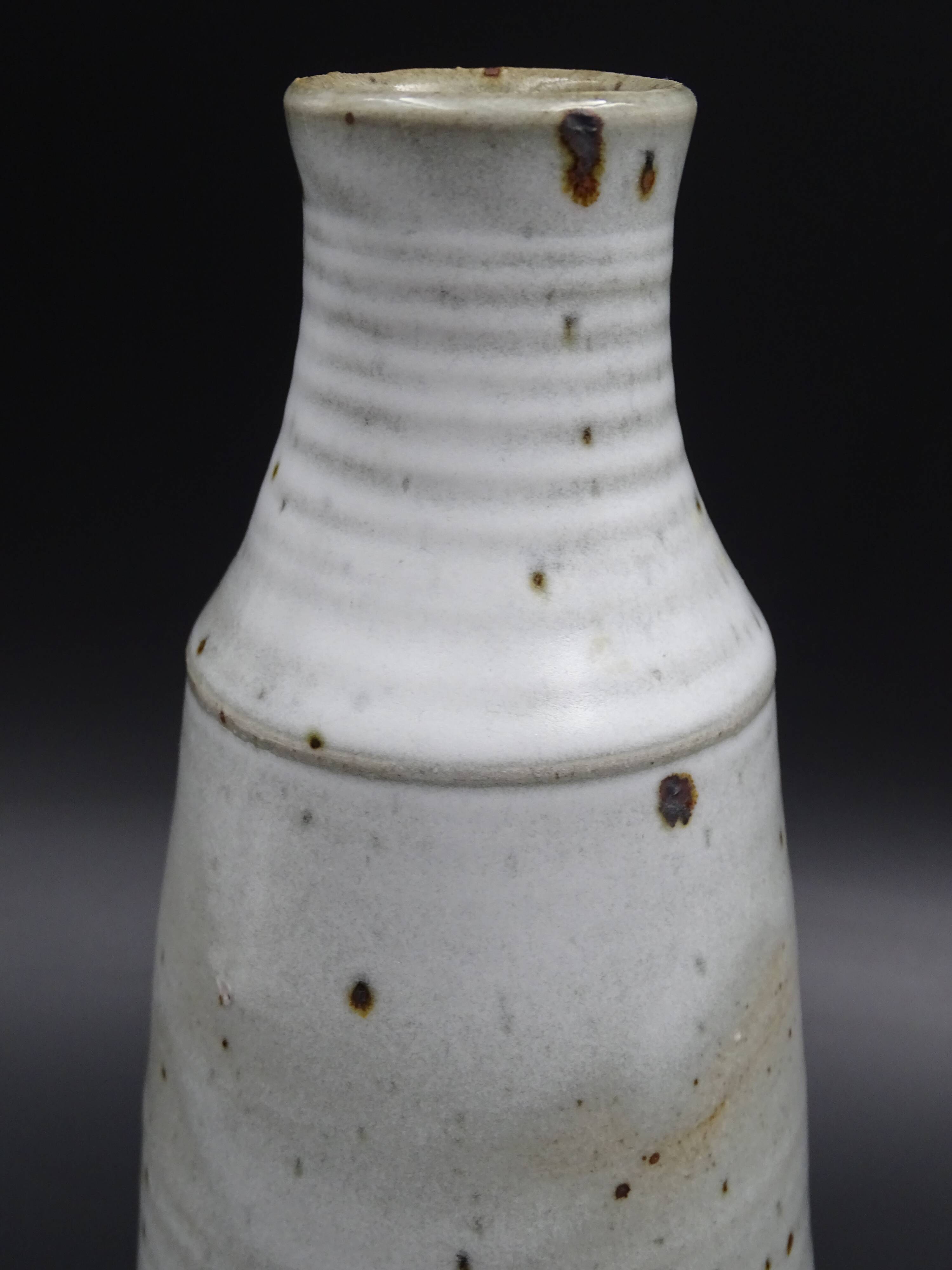 Sandstone vase with brown speckled decoration on a grey background - Bottle shape - Circa 1970 - Signed