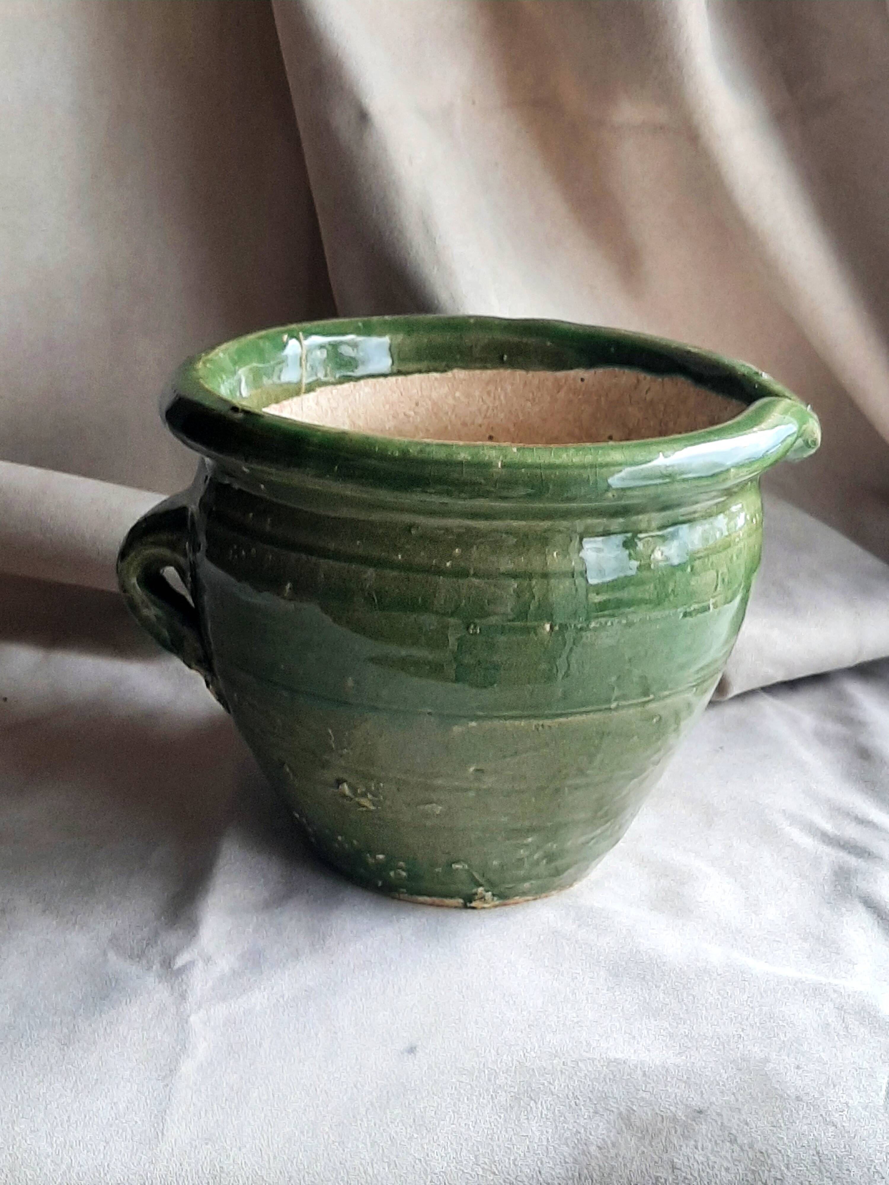 Glazed green terracotta pot.
