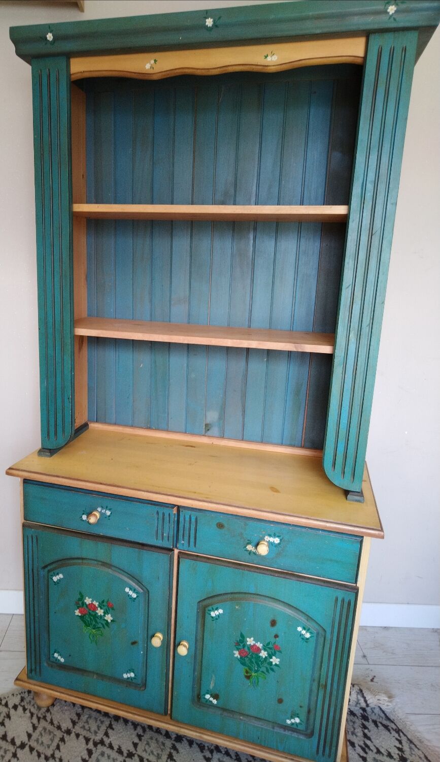 Rustic dresser with floral decor