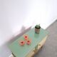 Vintage green DDR cabinet, model Libelle with glass top, slanted legs.