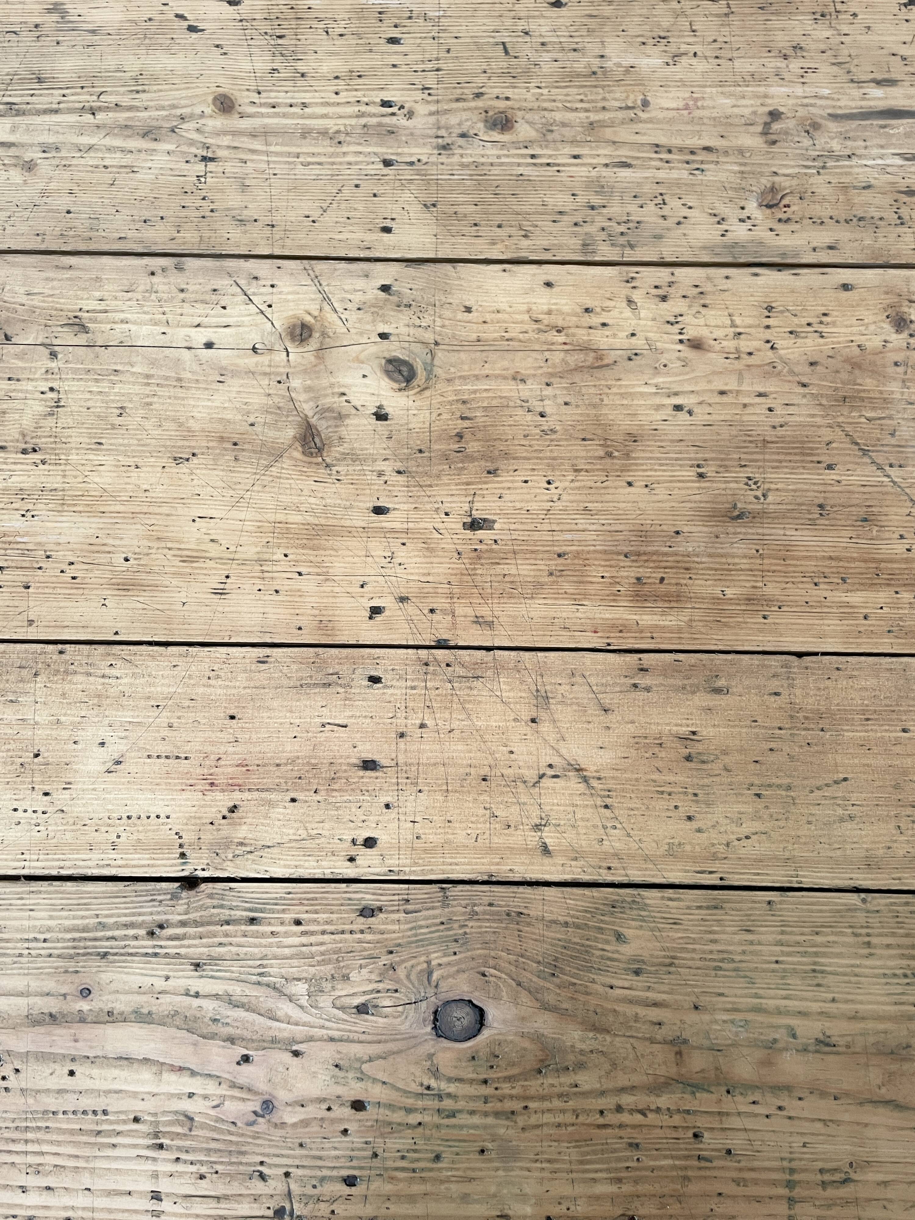 Solid wood workshop table with straight legs.