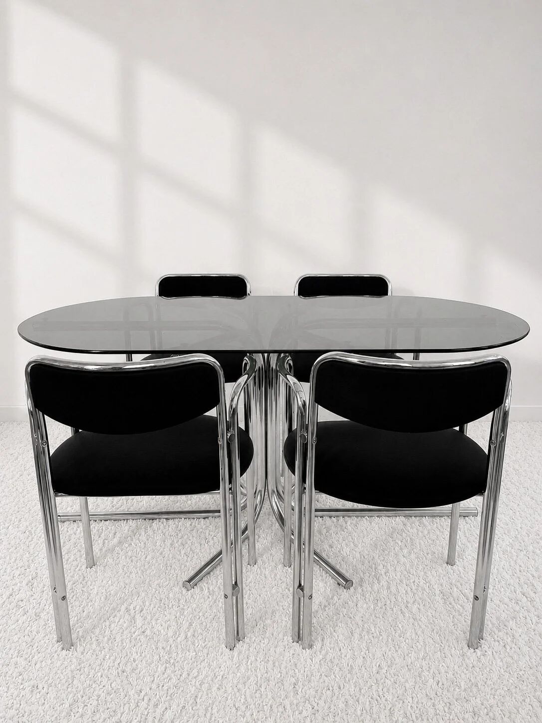 Vintage chairs with double chrome structure and black velvet. 70s