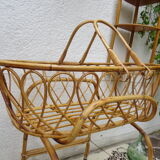 Rattan bassinet on folding support