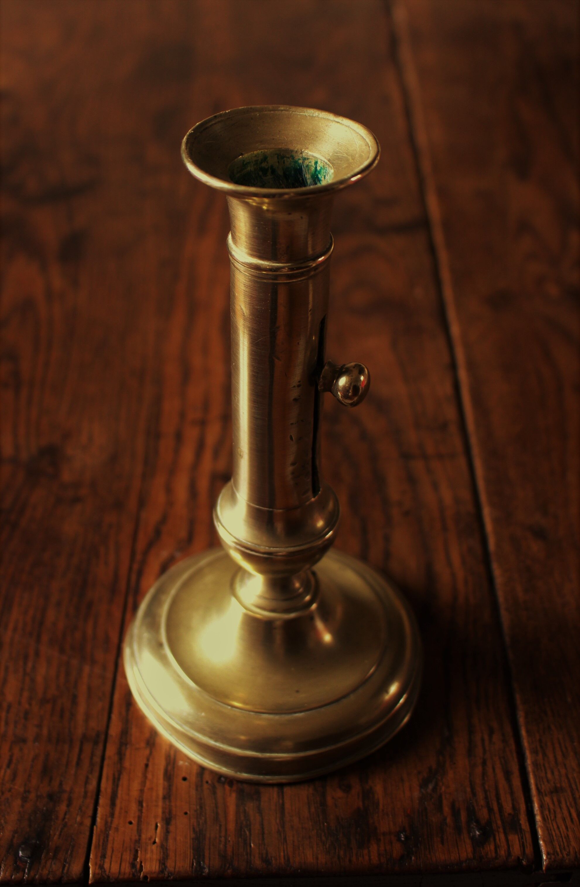 Brass pusher torch candle holder