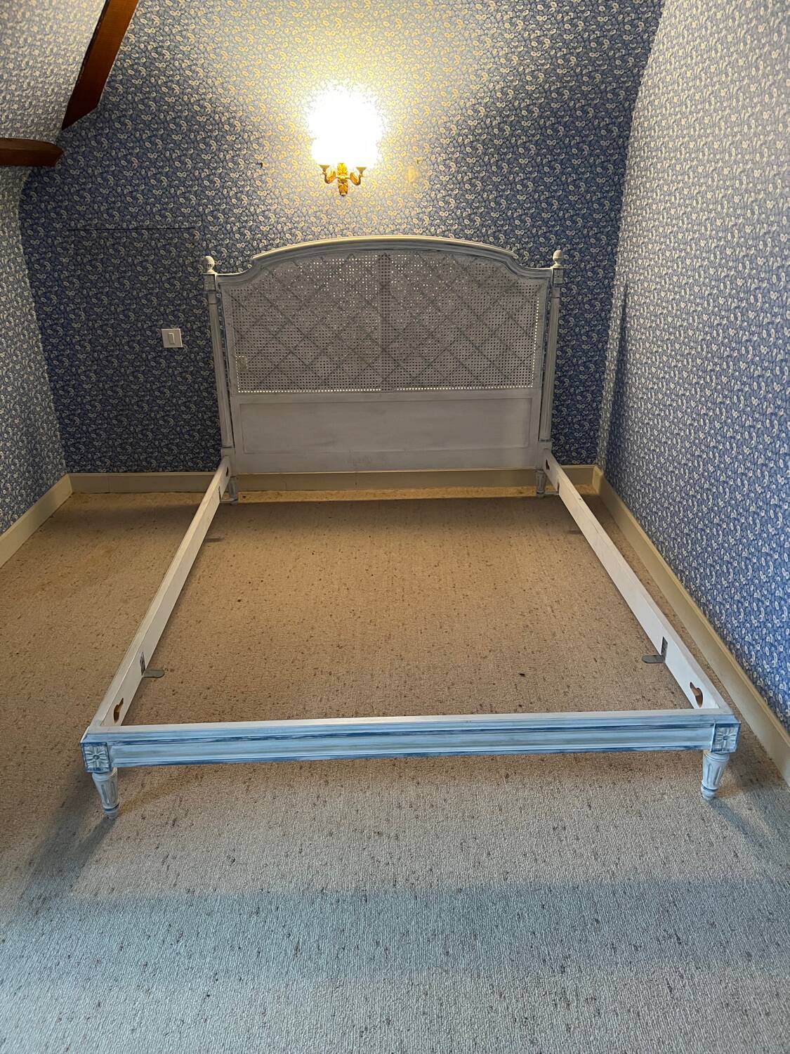 White wooden cane bed
