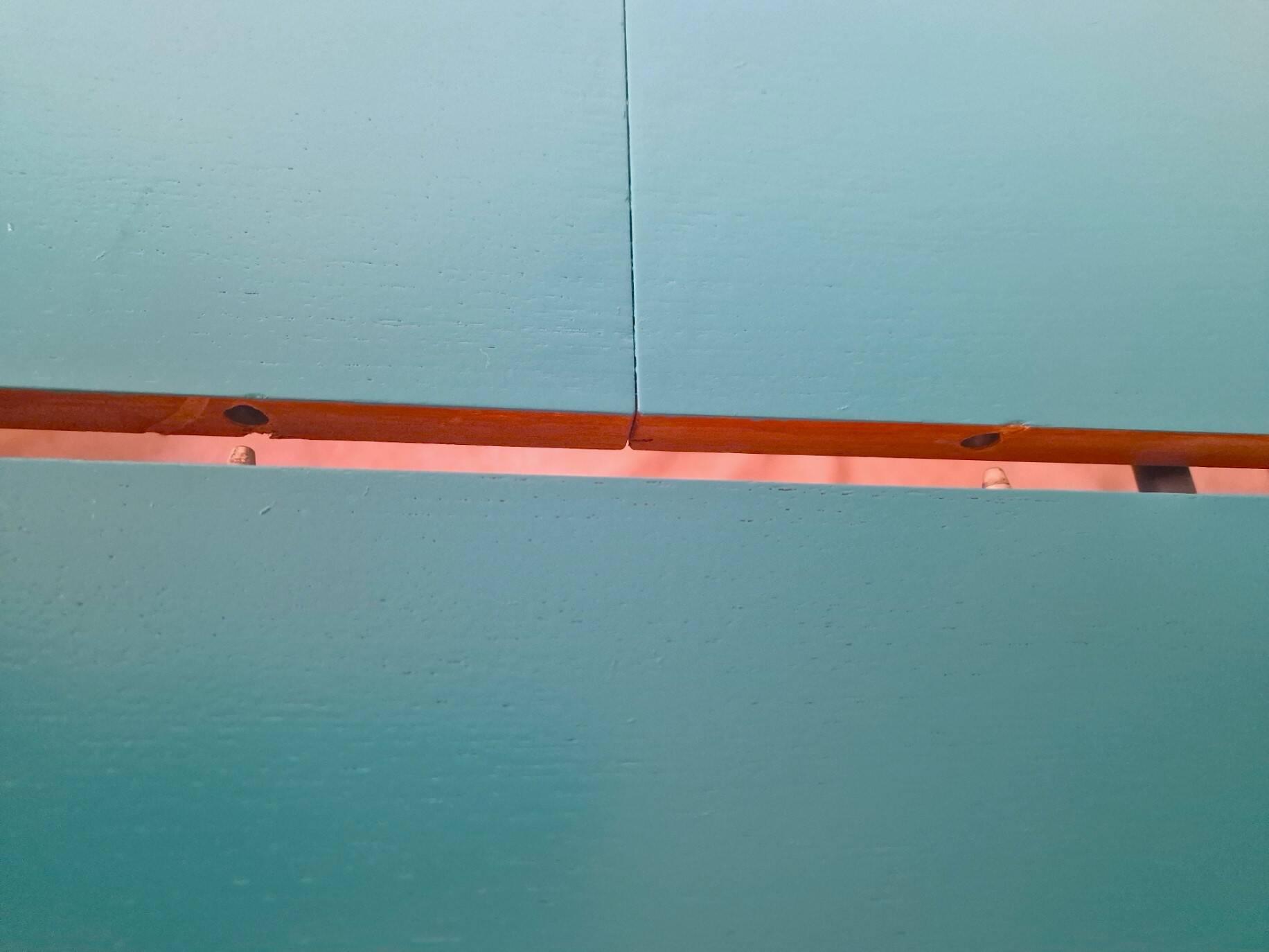 Extendable oval teak dining table