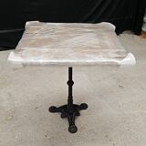 Bistro table with cast iron base and teak top