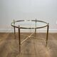 Neoclassical Round Coffee Table in Brass with Fluted Supports and Floral Motifs