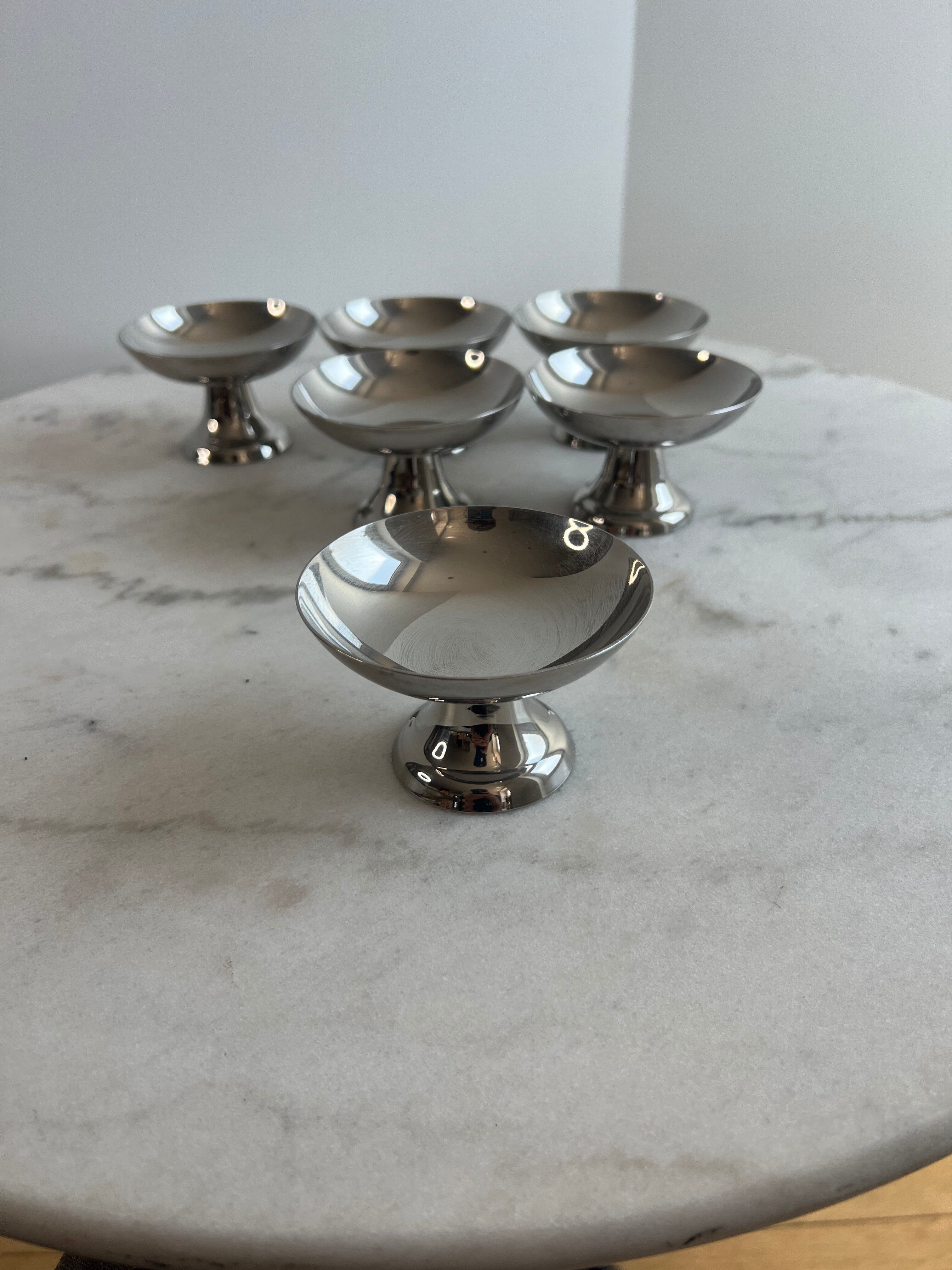 Set of 6 stainless steel dessert bowls on a stand.