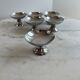 Set of 6 stainless steel dessert bowls on a stand.