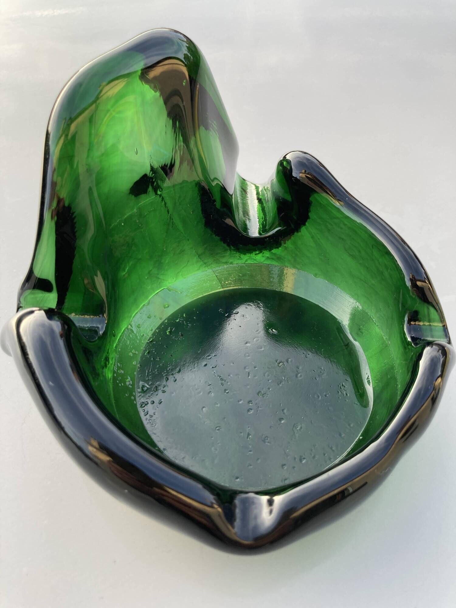 Sculptural ashtray in emerald green glass