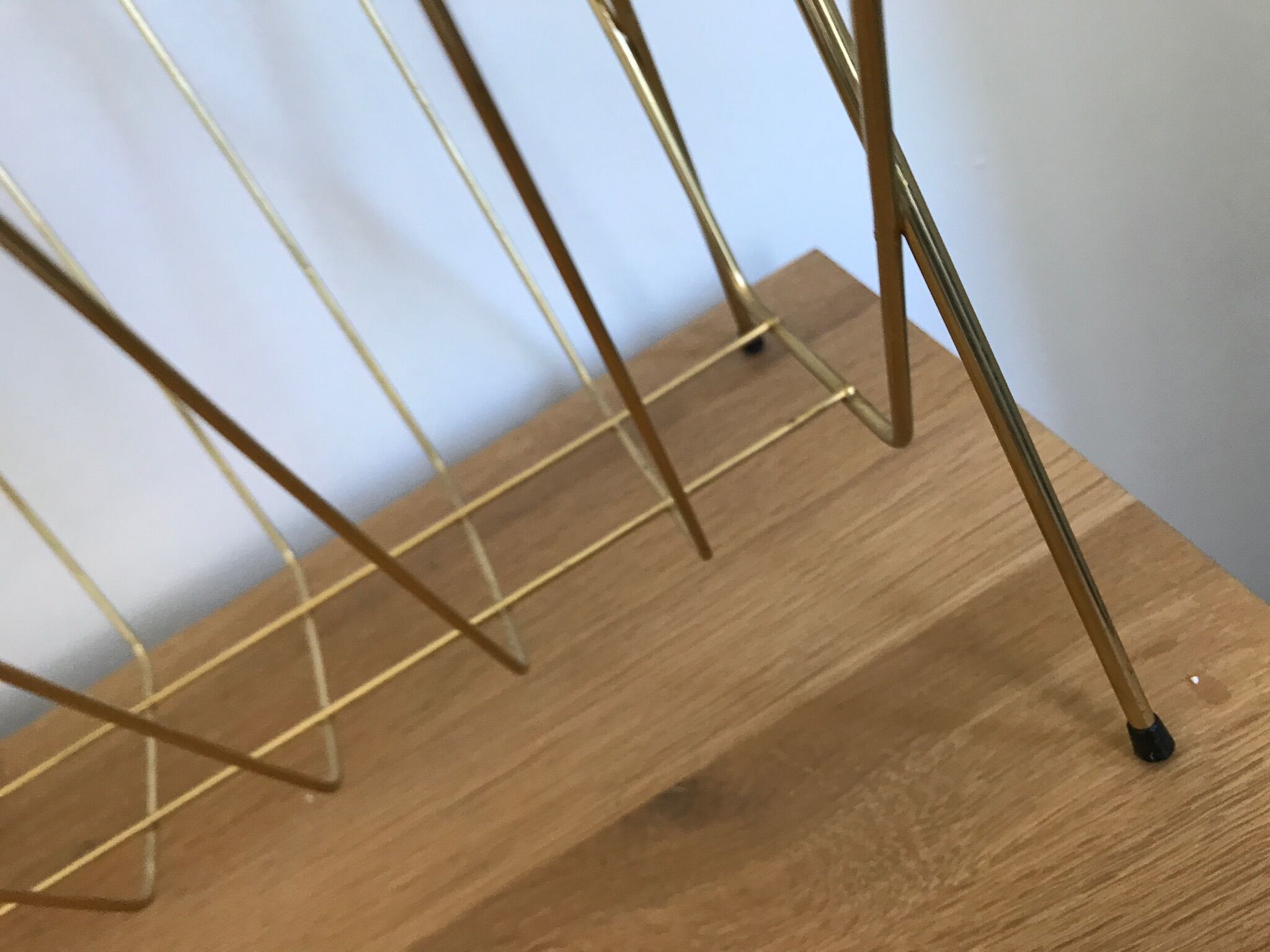Gold metal magazine rack