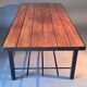Table basse moderniste vintage en teck et métal noir.