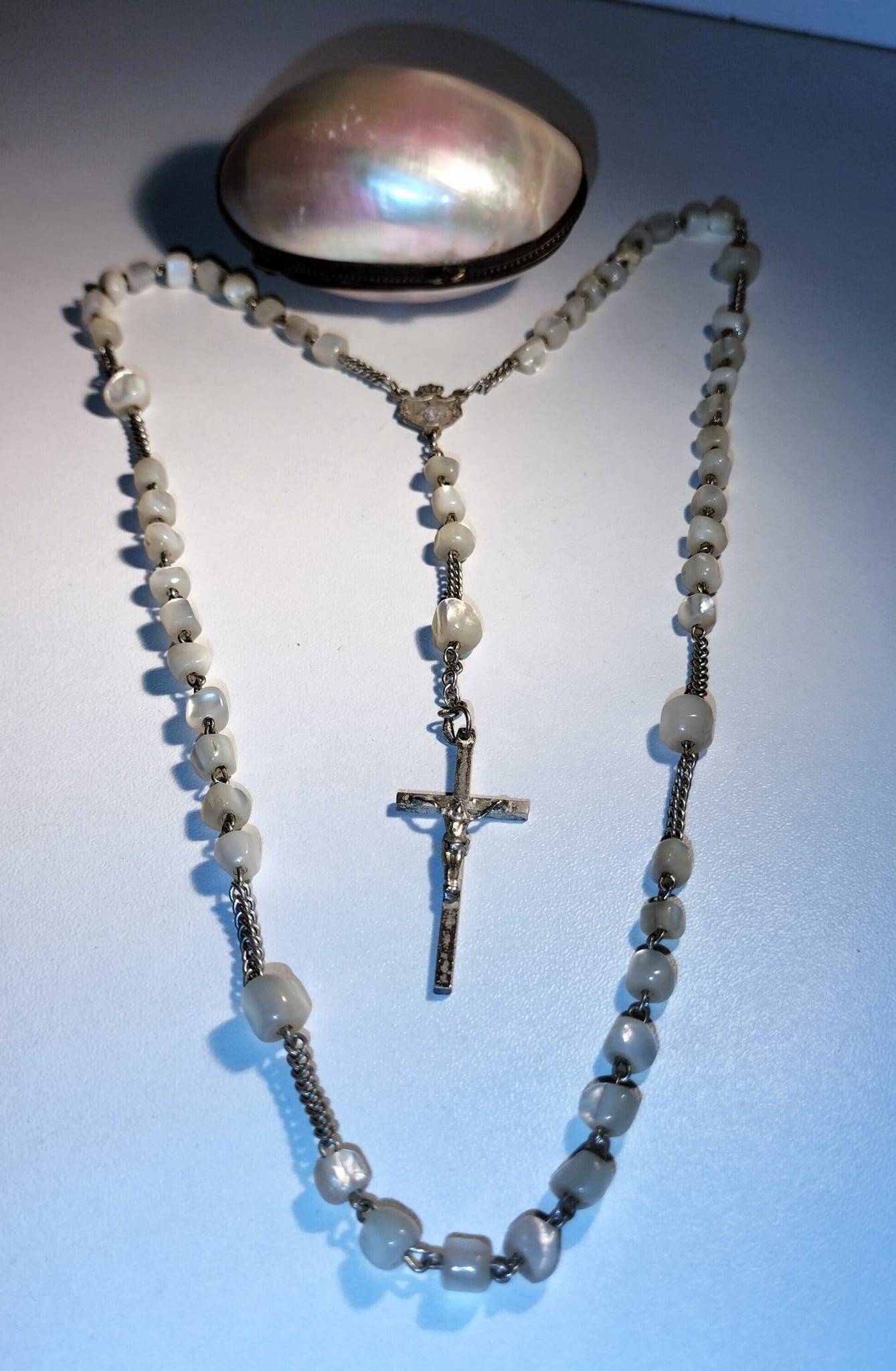 Old mother-of-pearl rosary in its egg box