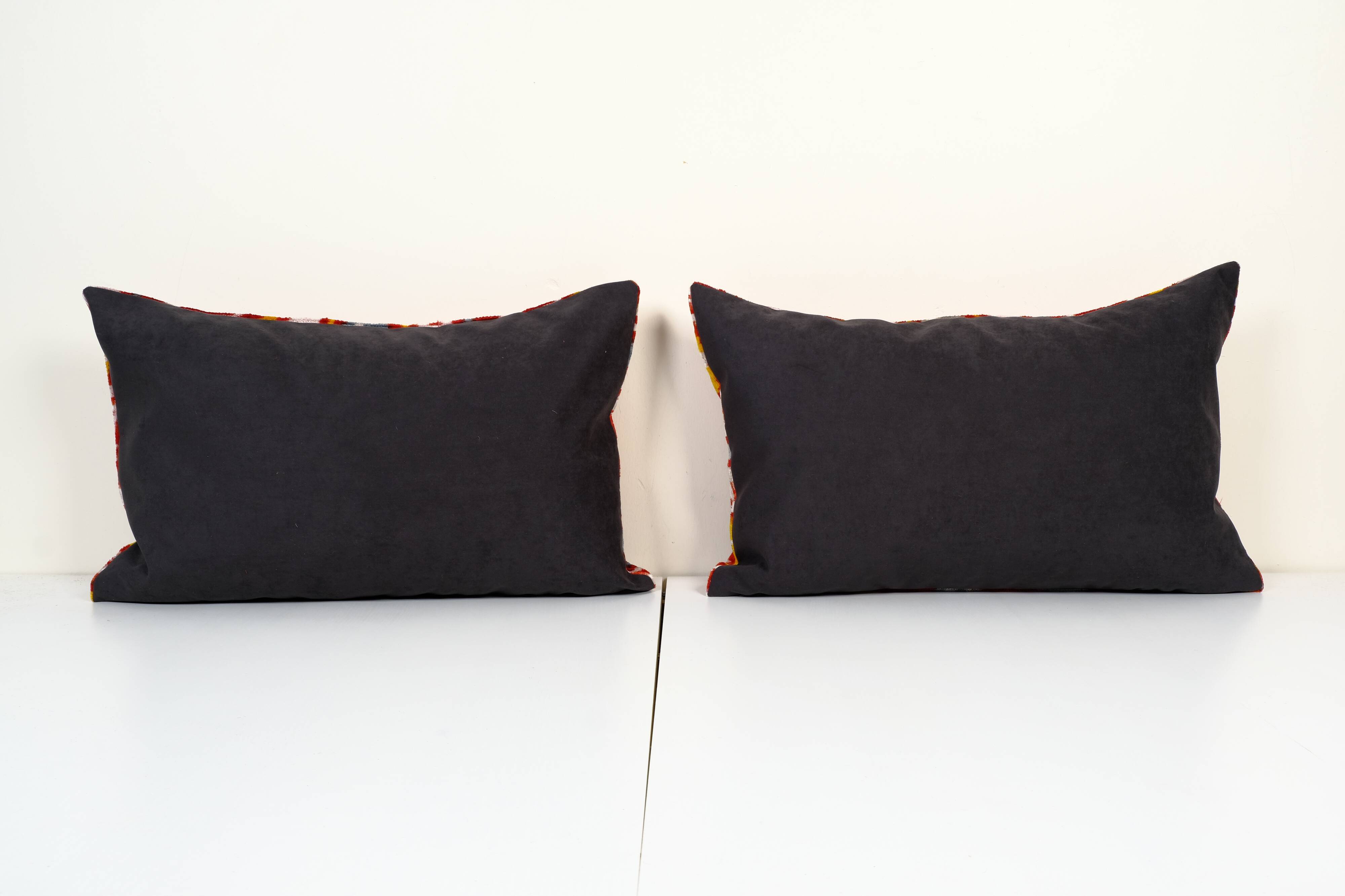 Set of two red ikat velvet lumbar pillows