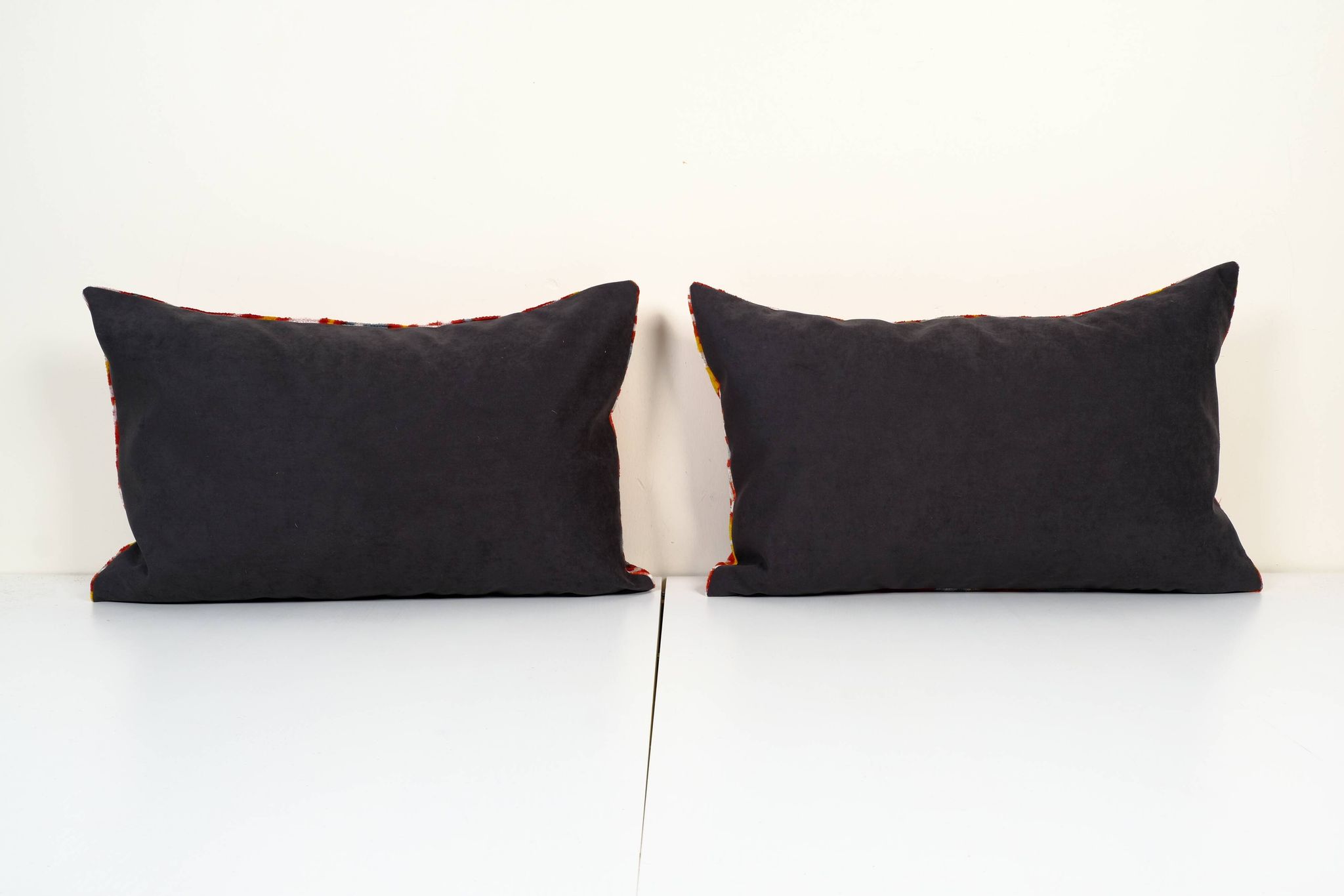 Set of two red ikat velvet lumbar pillows