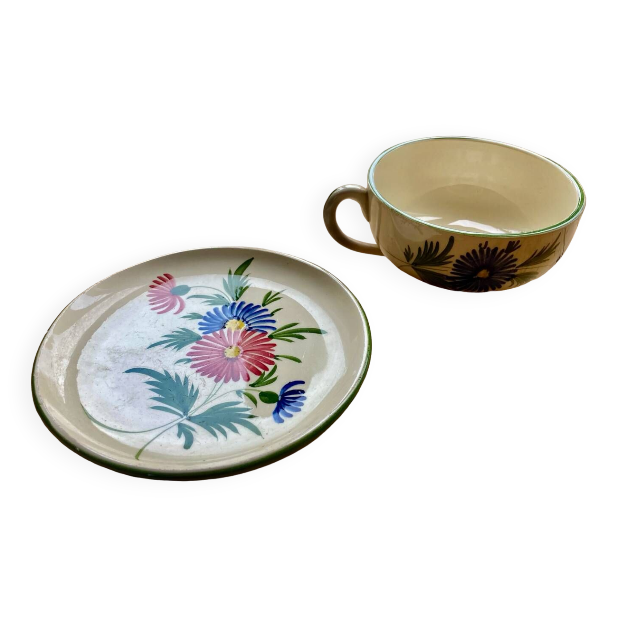 Large cup and saucer in the quimper earthenware style.