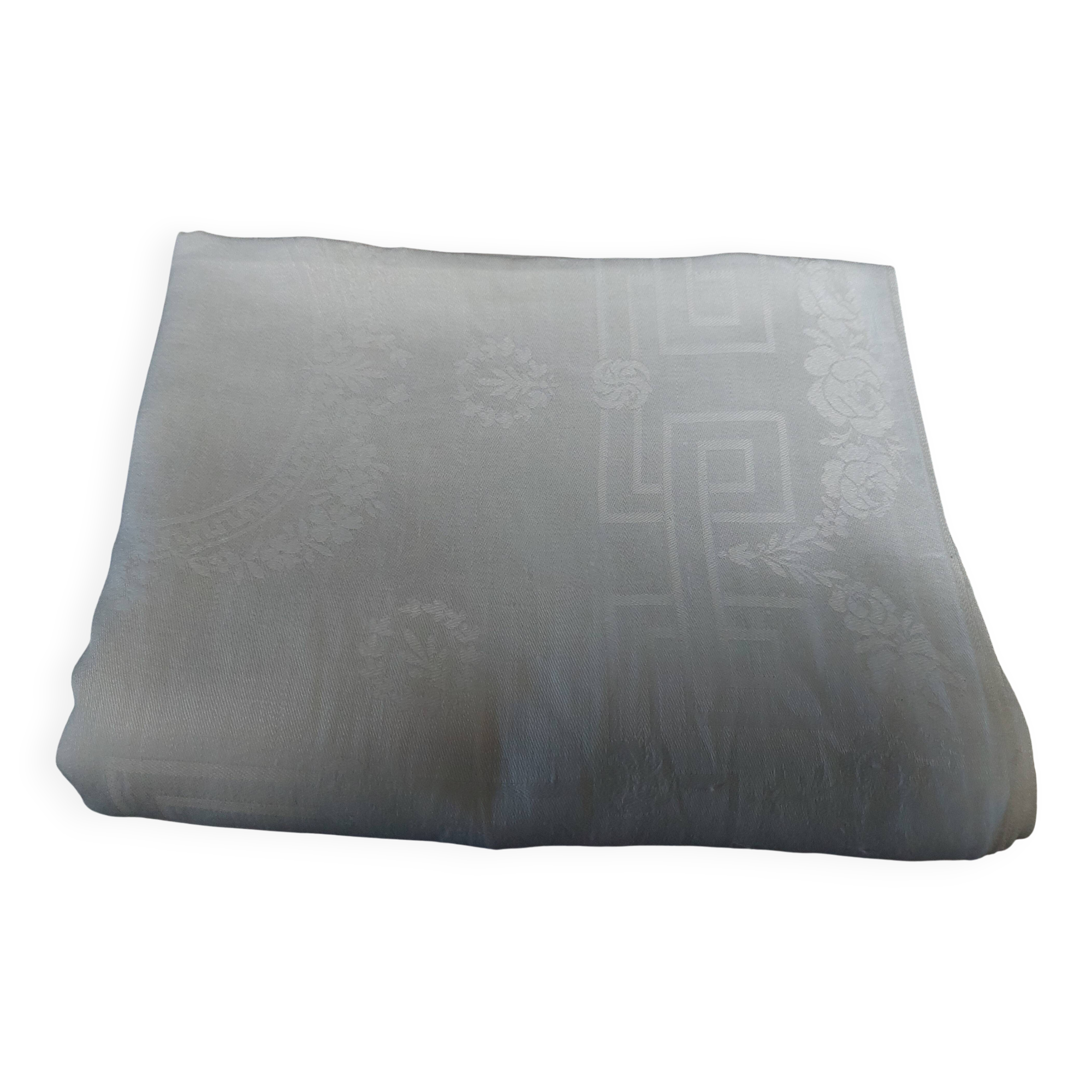 Table napkins set of eleven in a single piece damask linen and silk early 20th century.