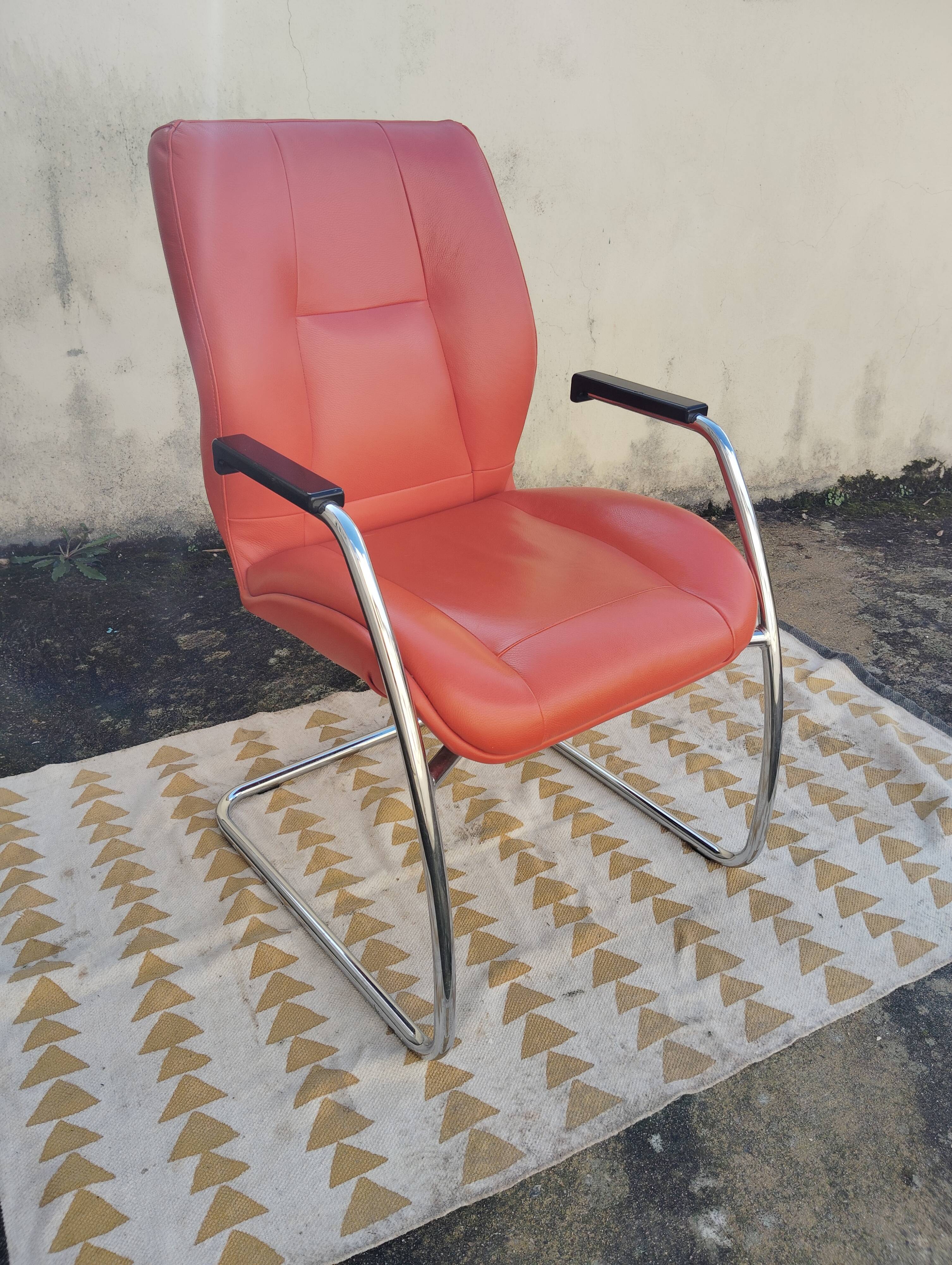 Orange leather cantilever tubular armchair