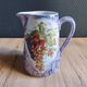 Vintage porcelain pitcher Lusseray France, decorated with grape clusters.