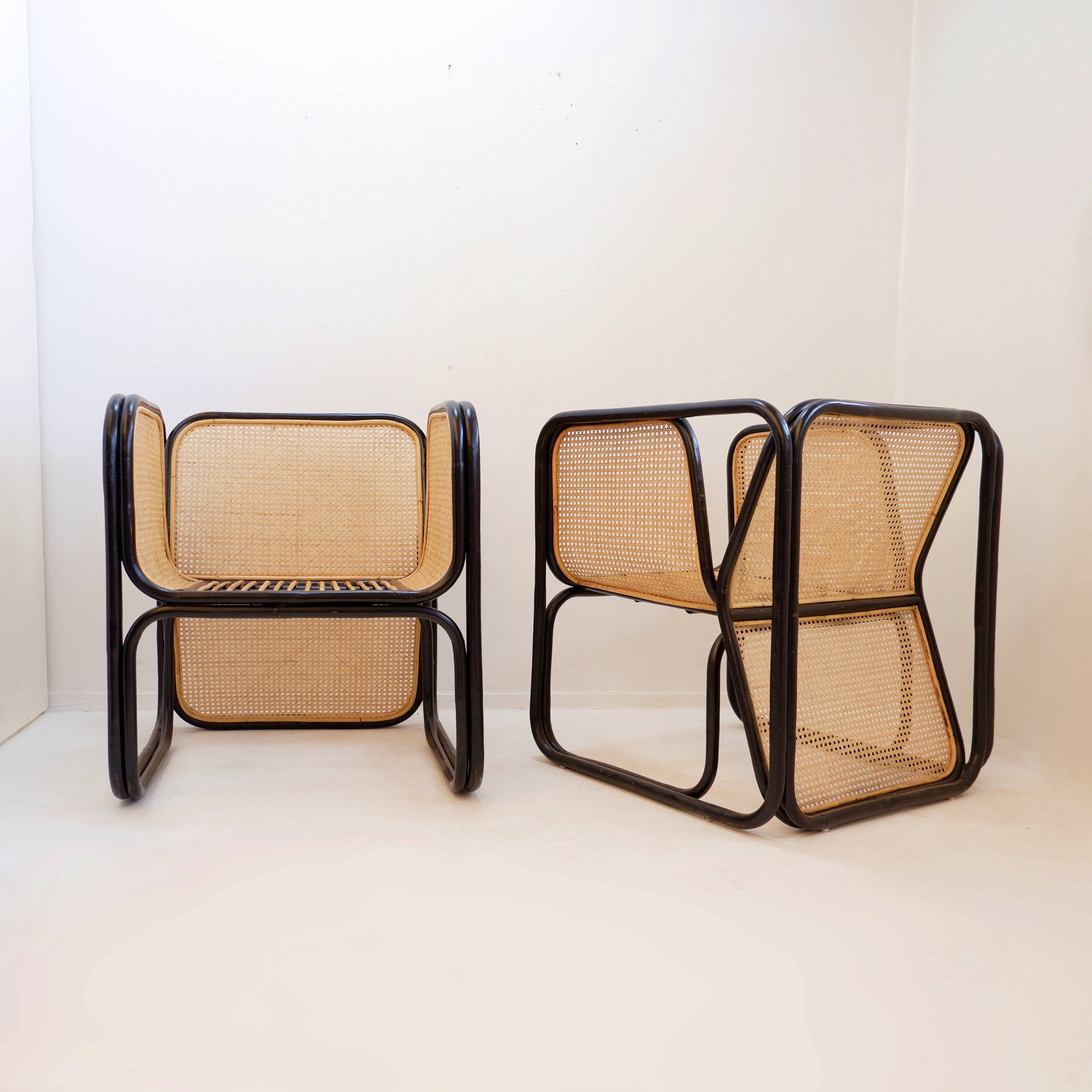 Pair of designer armchairs in curved wood and wicker