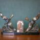 Pair of art deco seagull bookends in regulates and marble, bookcase, desk