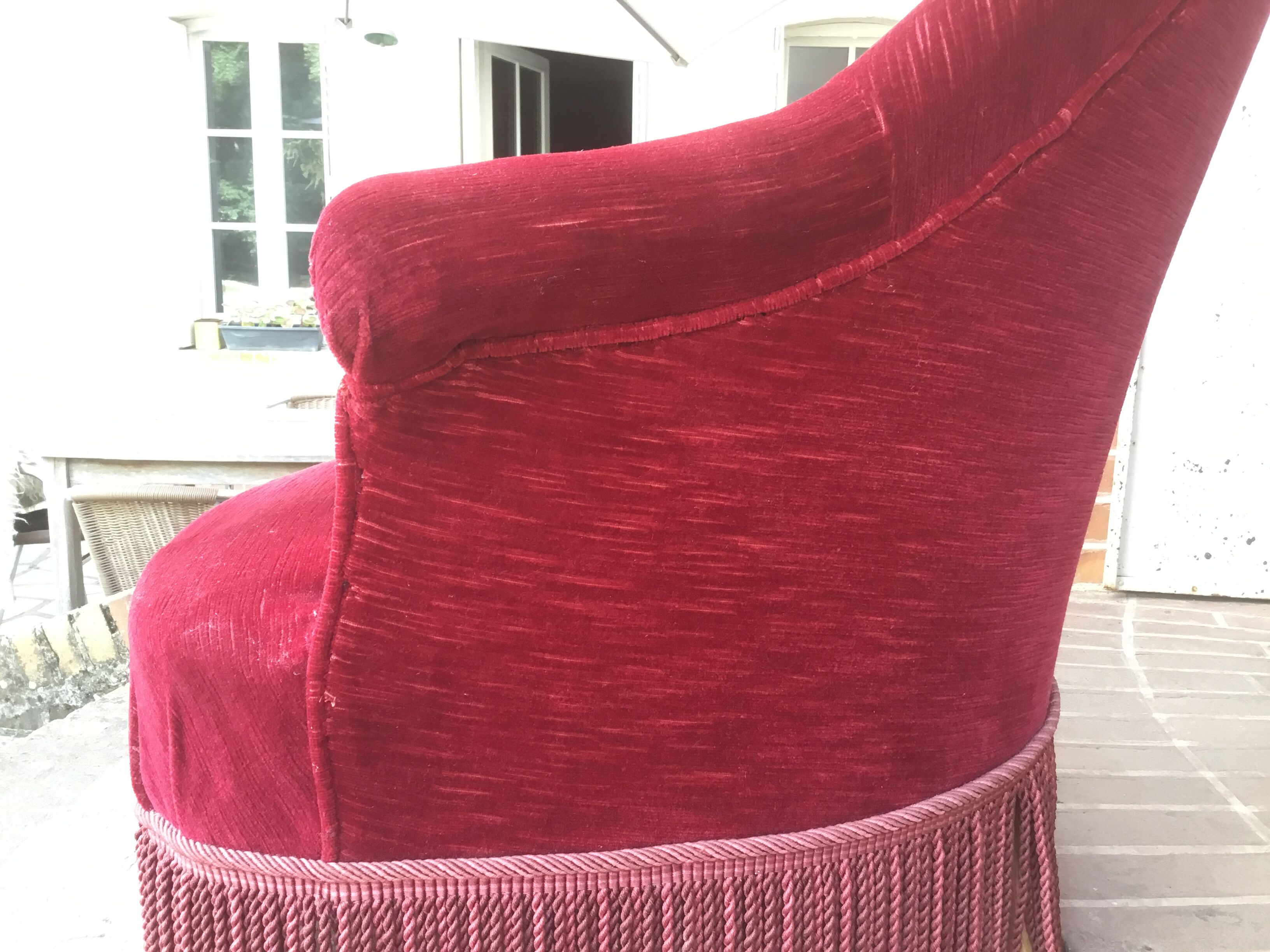 Old toad armchair in red velvet