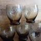 Set of 9 digestive glasses, smoked glass cut in art deco style
