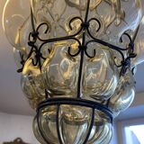 Blown glass and metal lantern