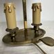 A pair of old brass bed warmers.