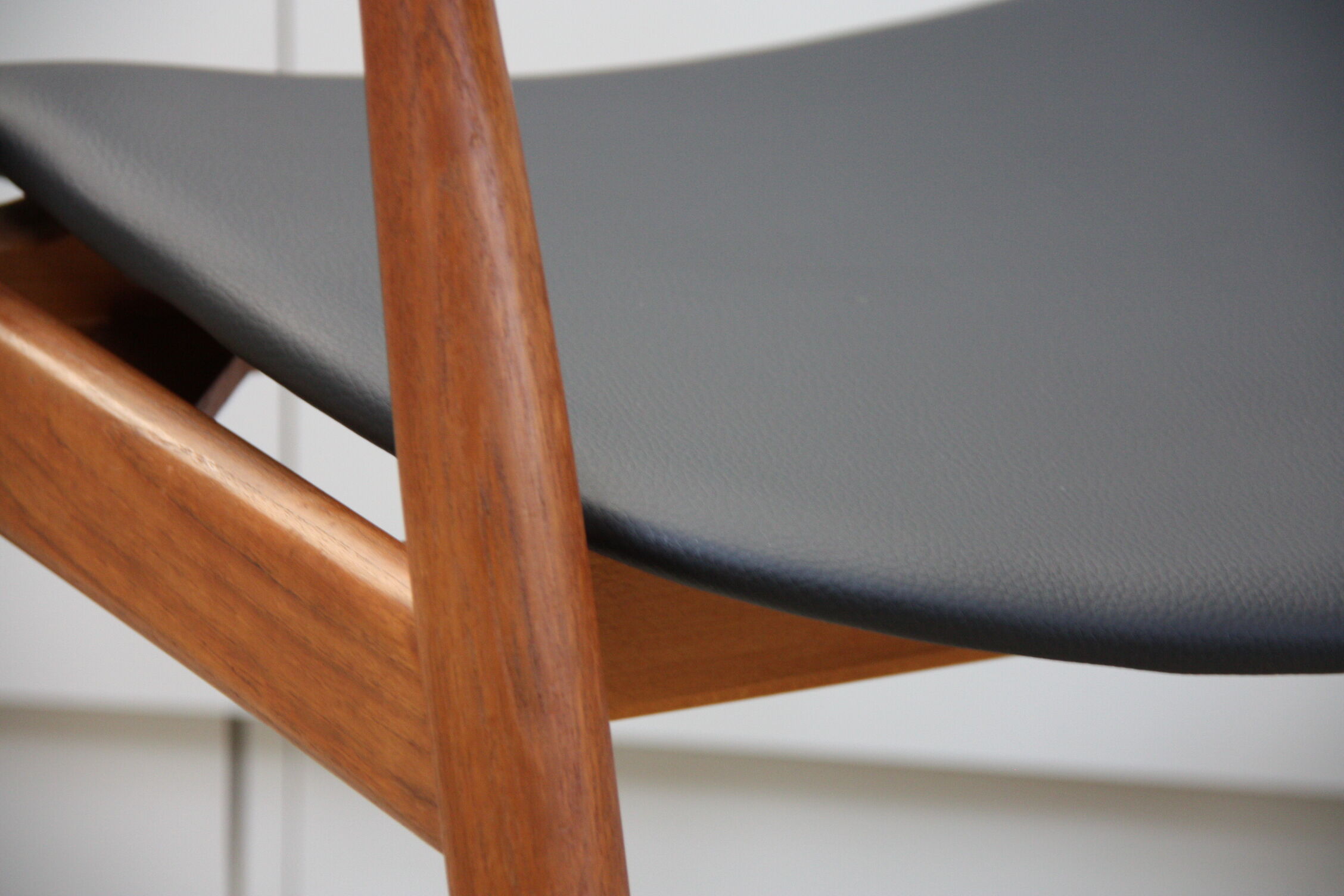 Vintage armchair in teak and black leather model Casina 60s