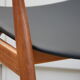Vintage armchair in teak and black leather model Casina 60s