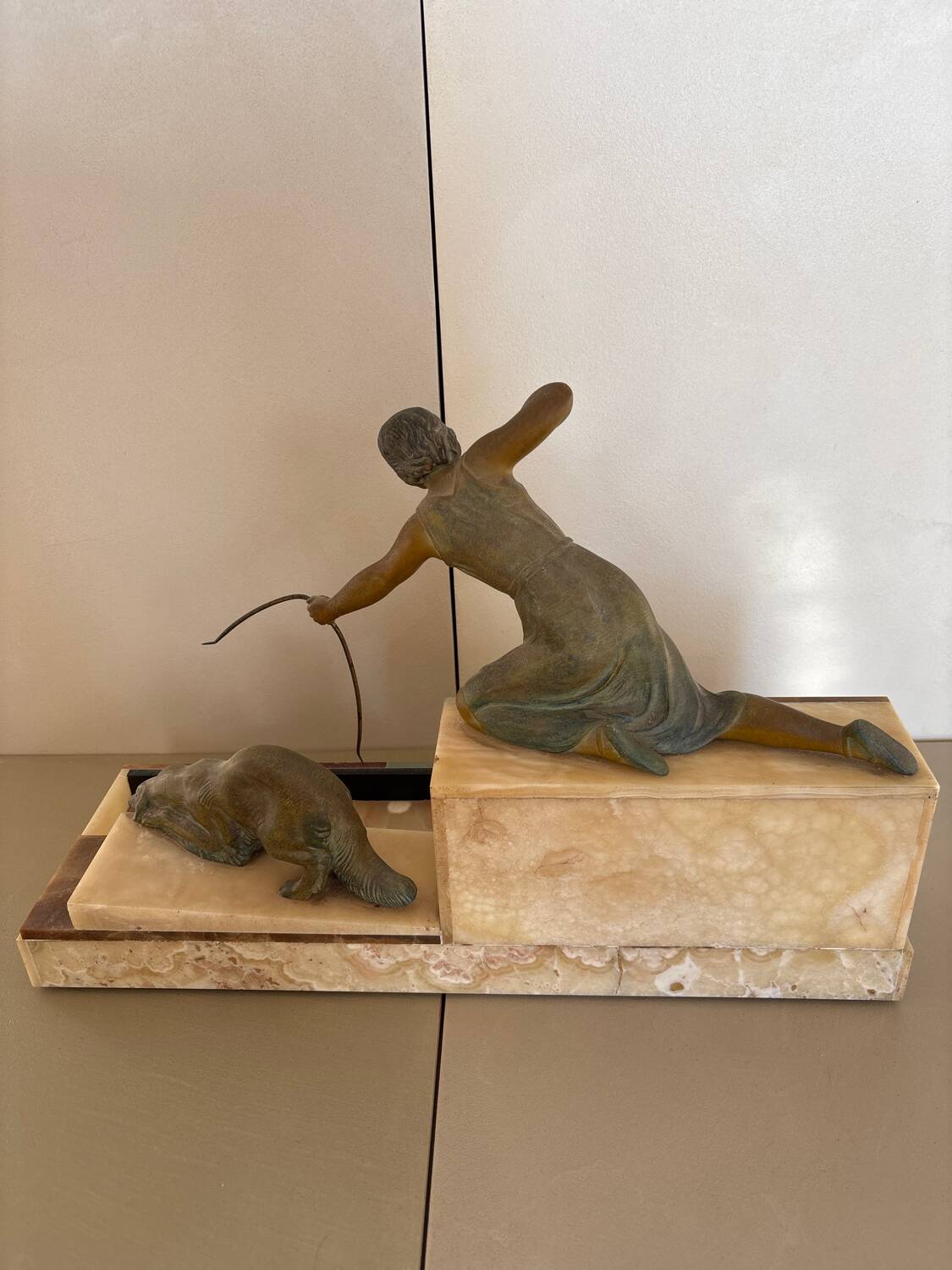 Sculpture of a woman with a greyhound