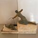Sculpture of a woman with a greyhound