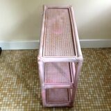 Pink rattan and cane shelf