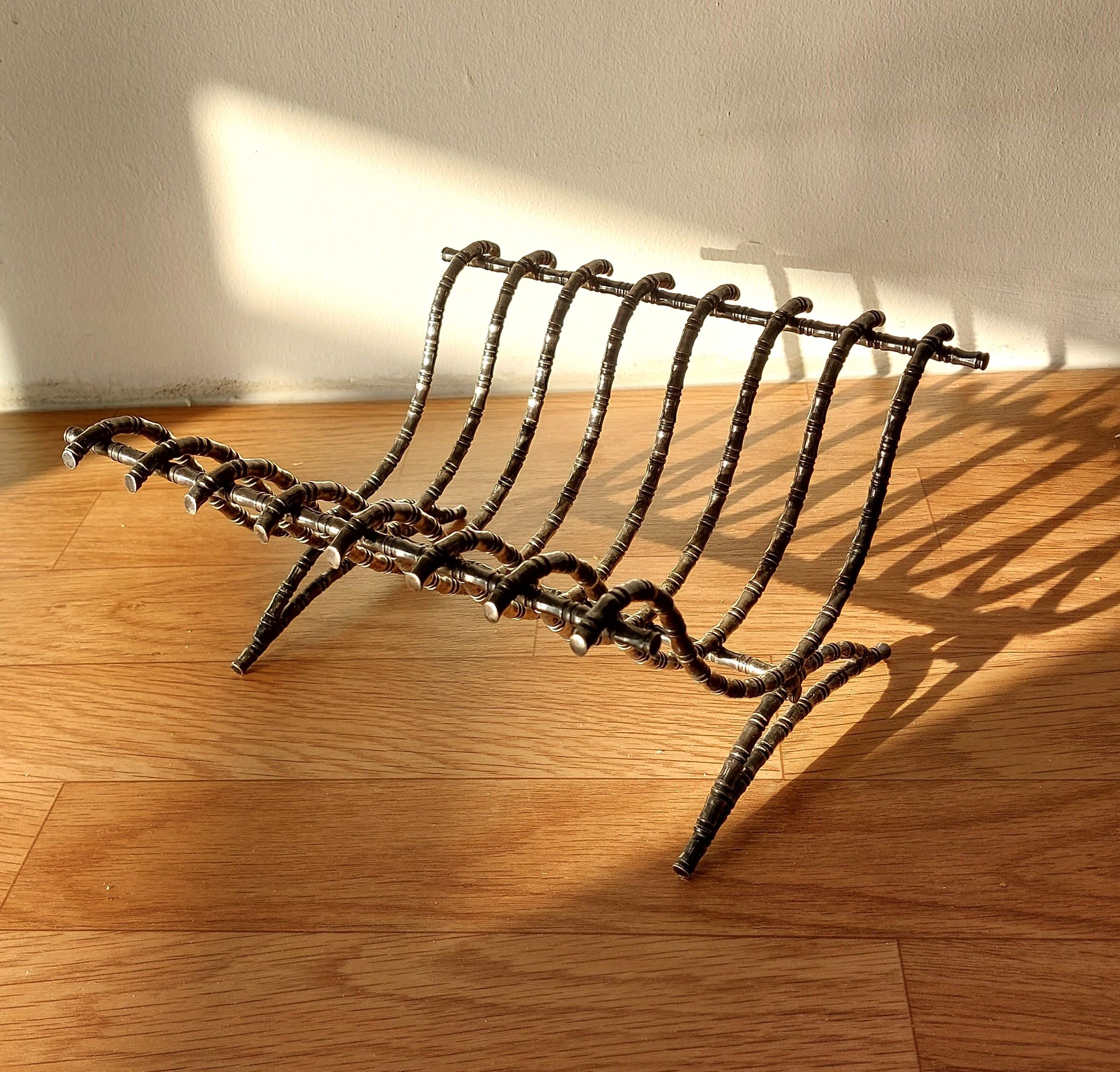 Silver metal cut in imitation of vintage bamboo.