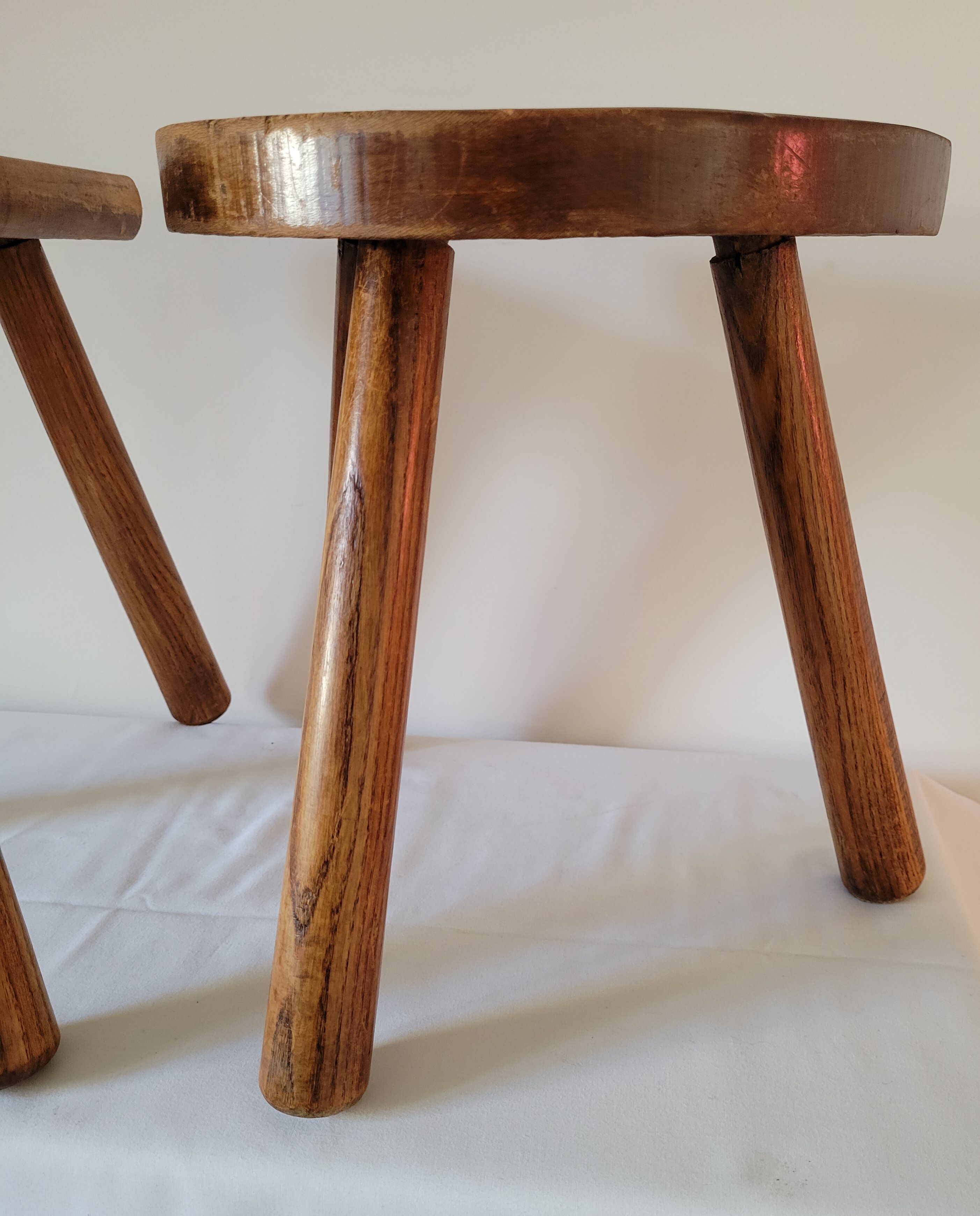 Pair of half-moon tripod stools