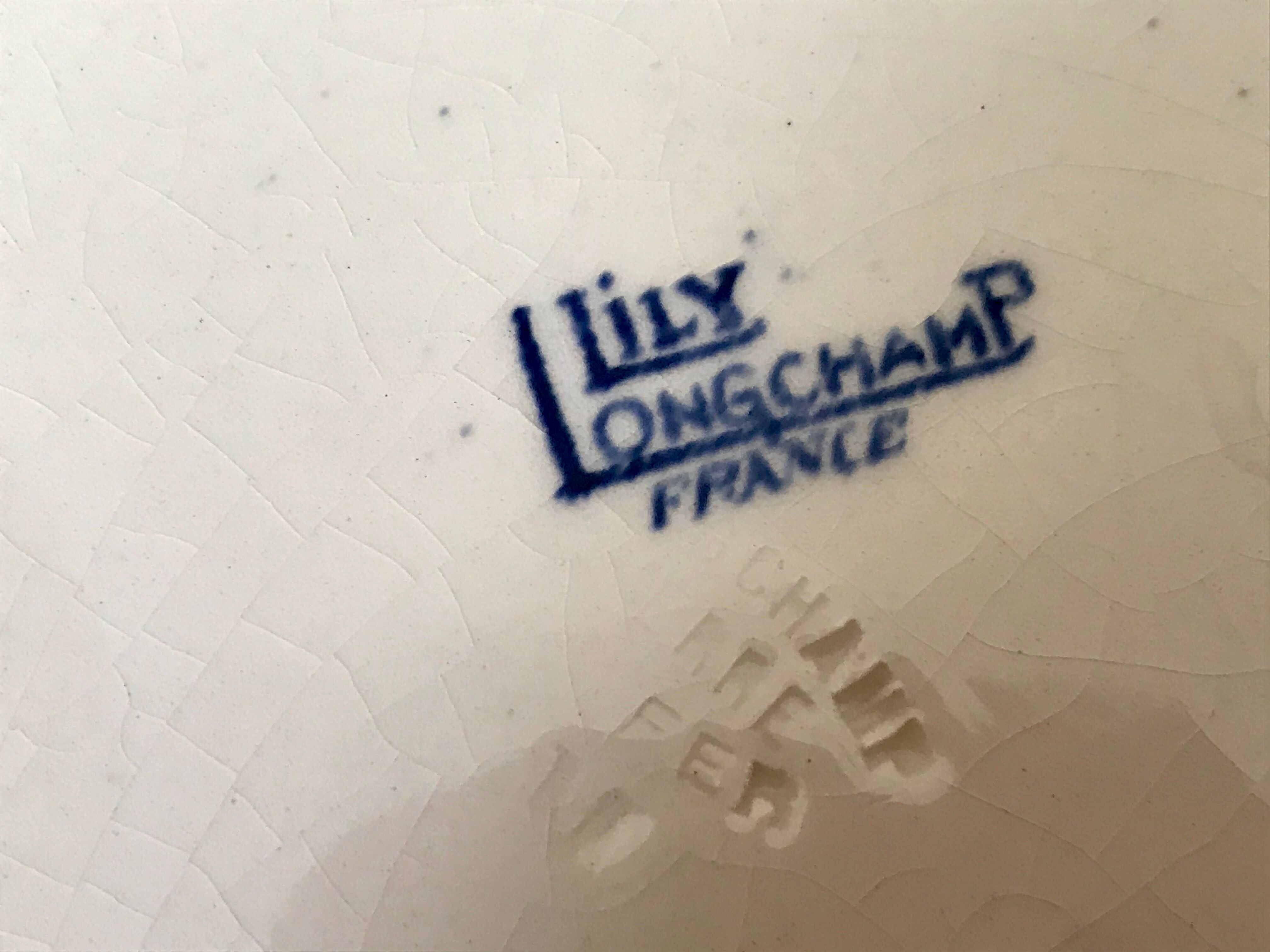 Lot of 5 lily Longchamp hollow plates, iron earth