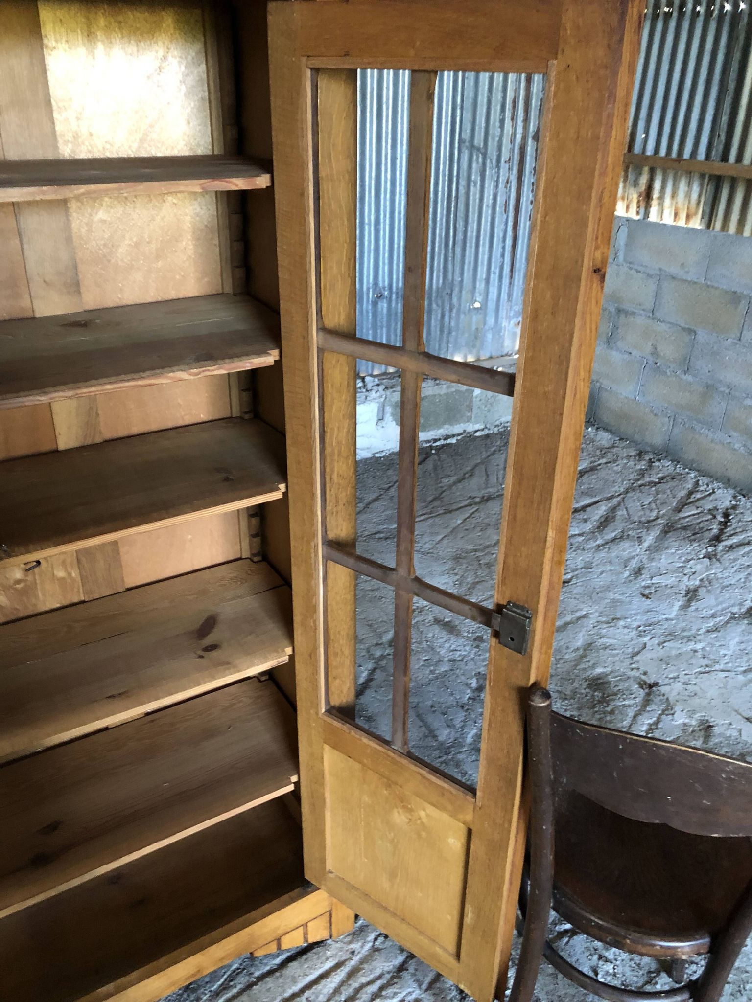 Vintage oak bookcase from the reconstruction period with 2 doors with small panes.