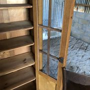 Vintage oak bookcase from the reconstruction period with 2 doors with small panes.