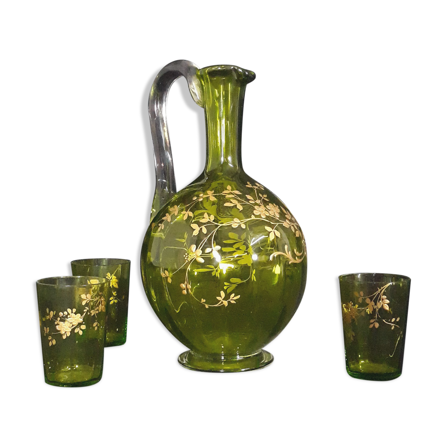 Small carafe and green glass drop glasses with rococo golden emailed decor