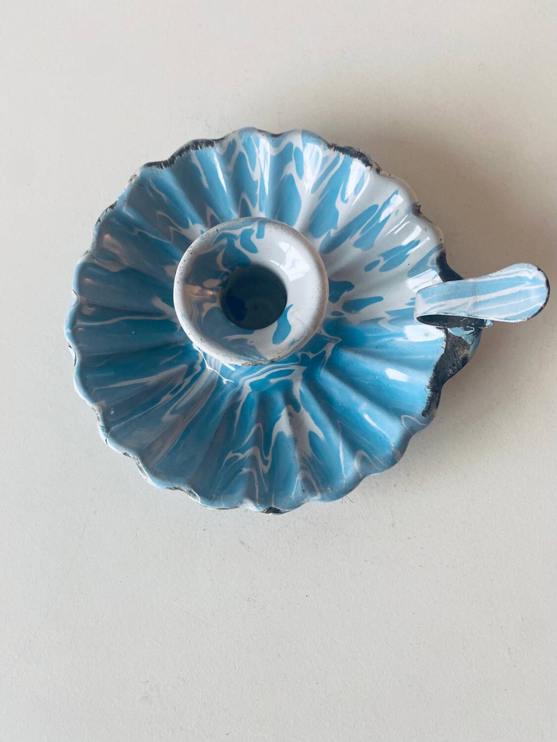 Old blue enameled metal candle holder