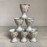 Six hand-decorated and signed egg cups
