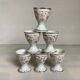Six hand-decorated and signed egg cups