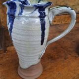 Enameled stoneware pitcher signed