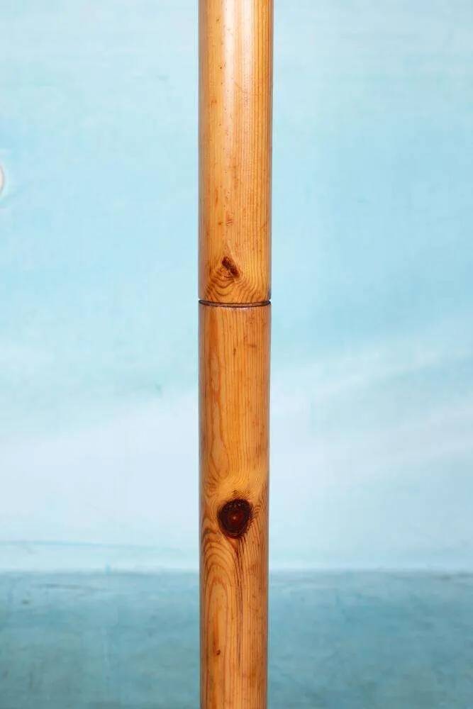 Minimalist organic coat rack in pine from the 1970s in space age style.