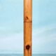 Minimalist organic coat rack in pine from the 1970s in space age style.